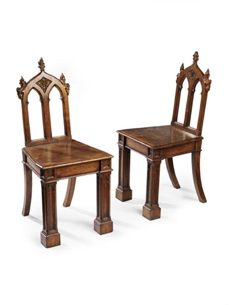 Appraisal: A pair of Victorian Gothic Revival oak hall chairs the