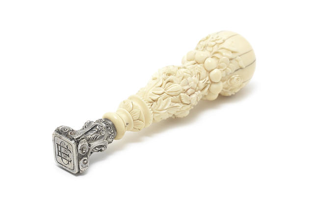 Appraisal: A th century silver-mounted ivory desk seal with boar's head