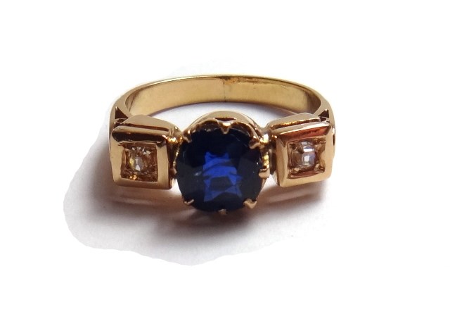 Appraisal: A gold sapphire and diamond set three stone ring claw