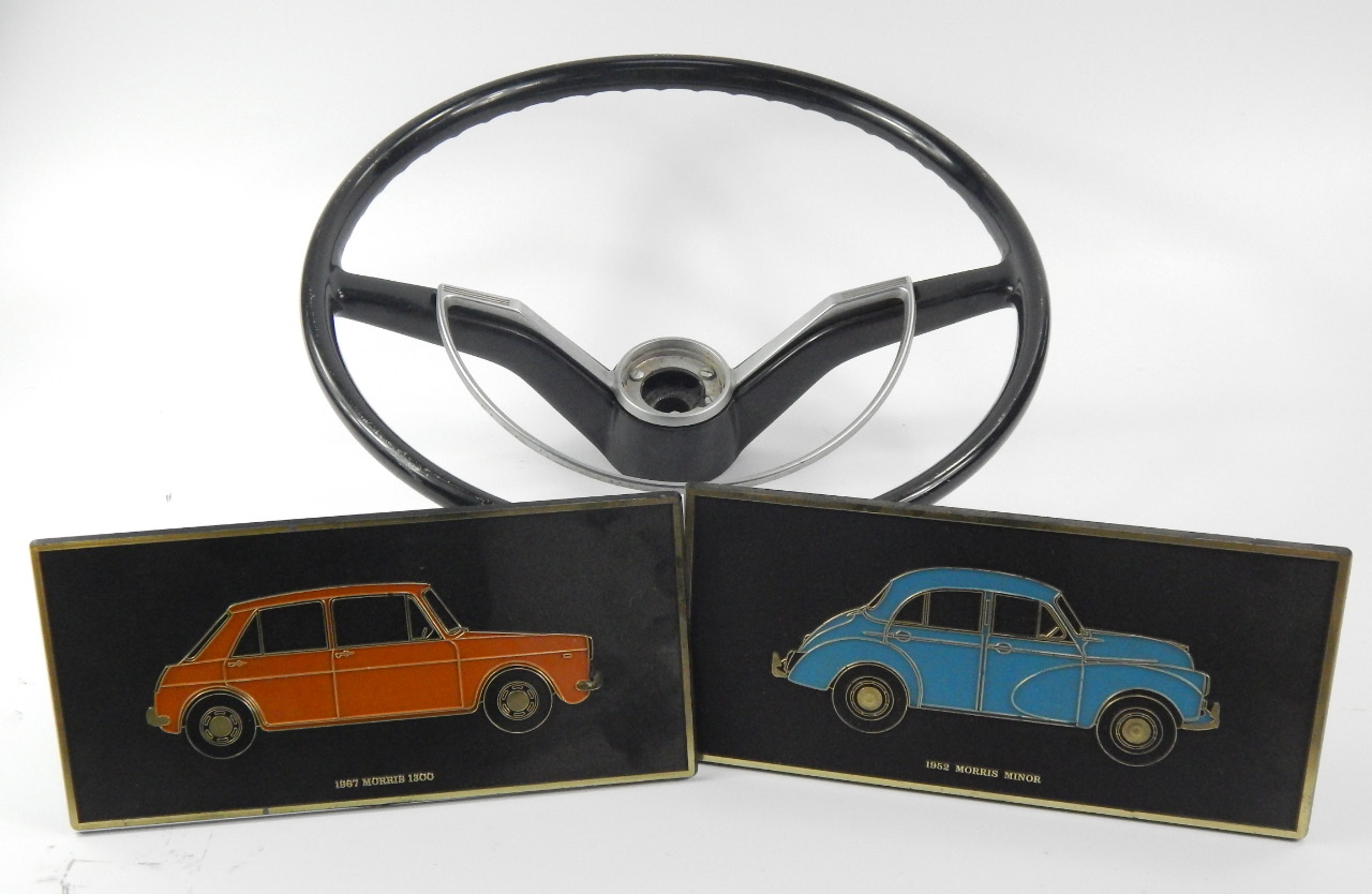 Appraisal: A classic Morris car steering wheel and two Unipart plastic