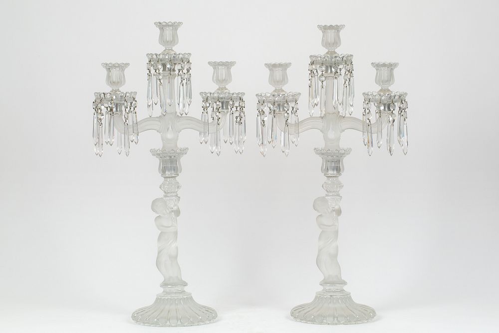 Appraisal: A PAIR OF BACCARAT CRYSTAL 'ENFANT' THREE-LIGHT CANDELABRA S A