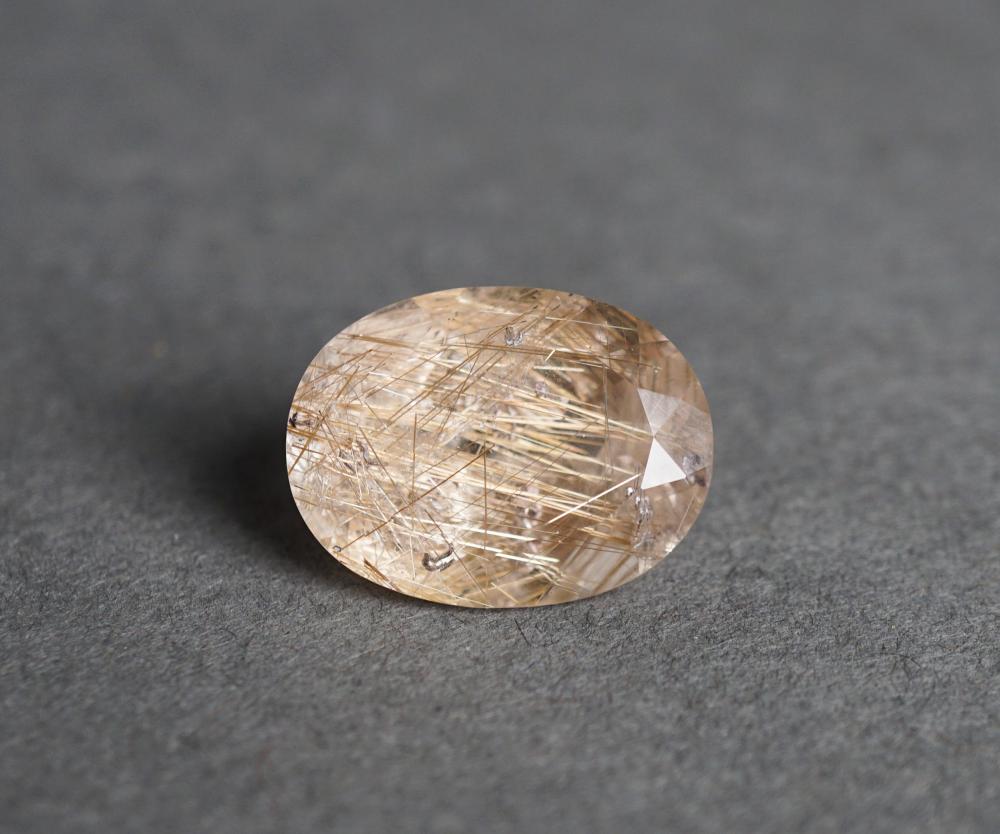 Appraisal: UNMOUNTED -CARAT OVAL FACETED RUTILE QUARTZUnmounted -Carat Oval Faceted Rutile