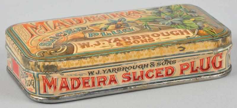 Appraisal: Madeira Slice Plug Pocket Tobacco Tin Description Beautiful image of