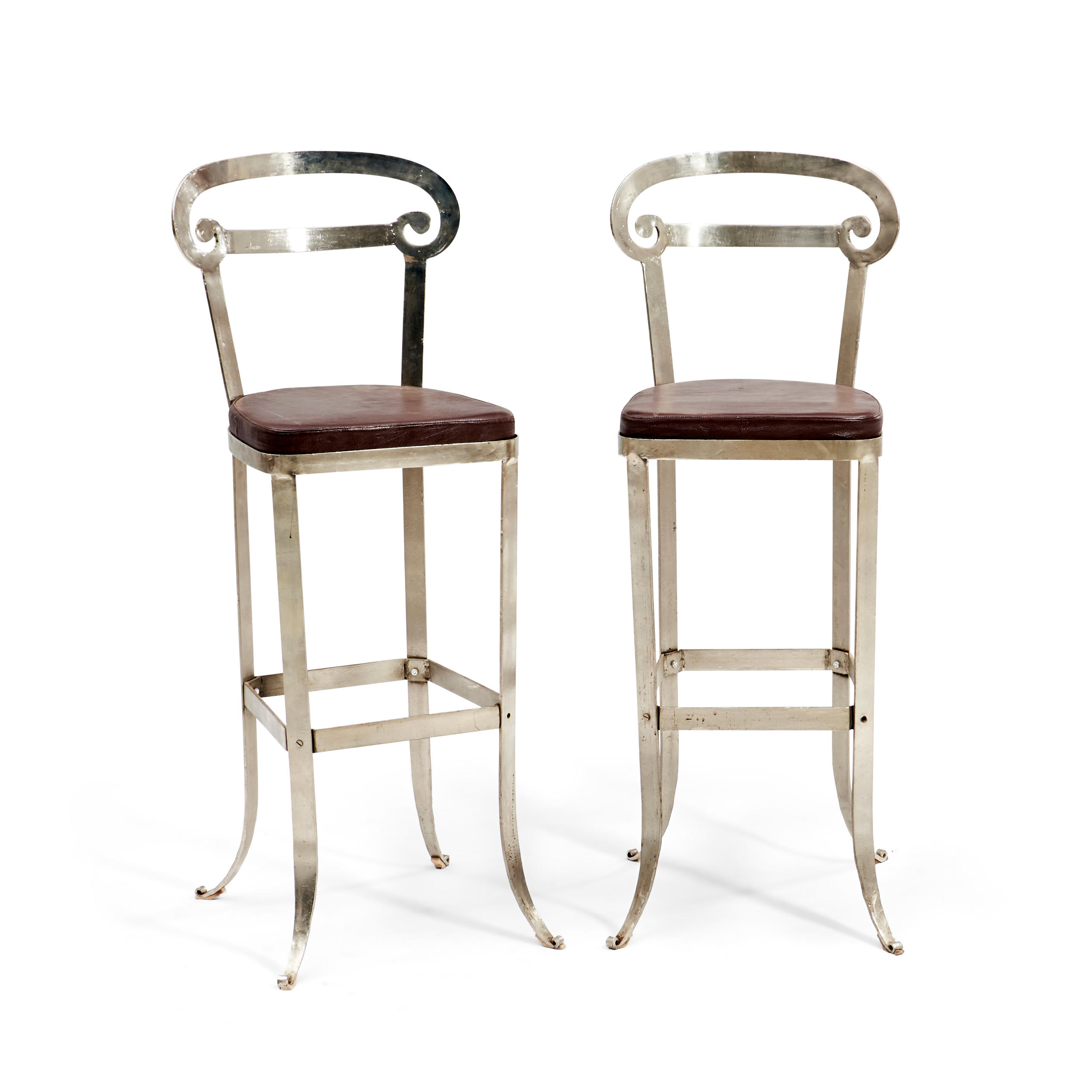 Appraisal: Pair of Contemporary Steel Barstools with leather-upholstered cushions scrolled back