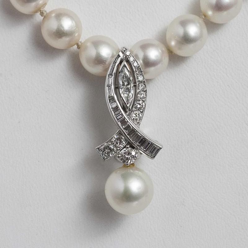 Appraisal: Pearl Diamond k Necklace Salt water pearl necklace with a