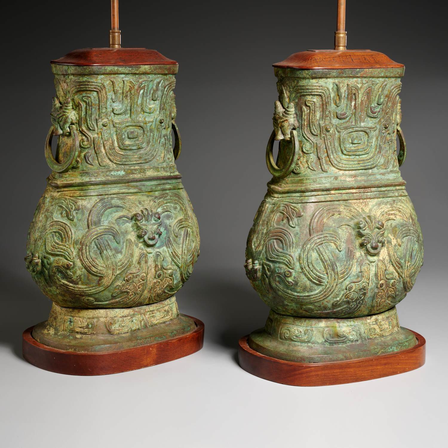 Appraisal: PAIR CHINESE ARCHAIC STYLE BRONZE URN LAMPS th c with