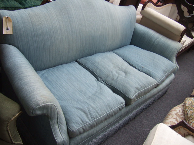 Appraisal: A th century three seater sofa upholstered in striped blue