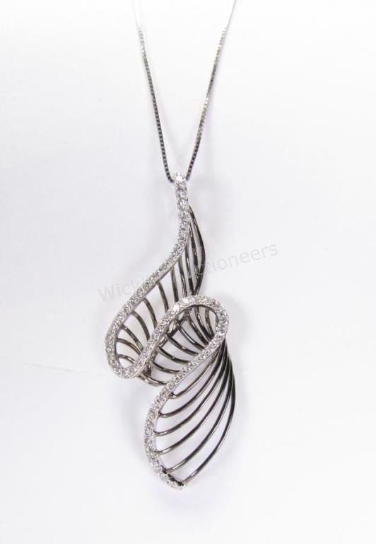 Appraisal: A K black rhodium and white gold contemporary swirl design