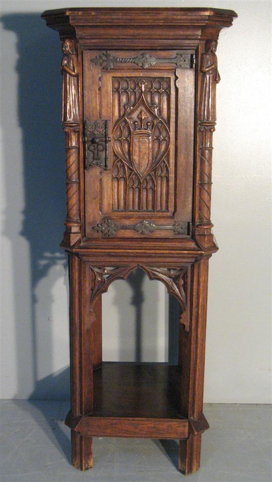 Appraisal: Oak square cupboard in Gothic style carved with two figures