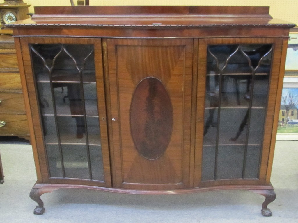 Appraisal: Mahogany bookcase raised on ball and claw supports