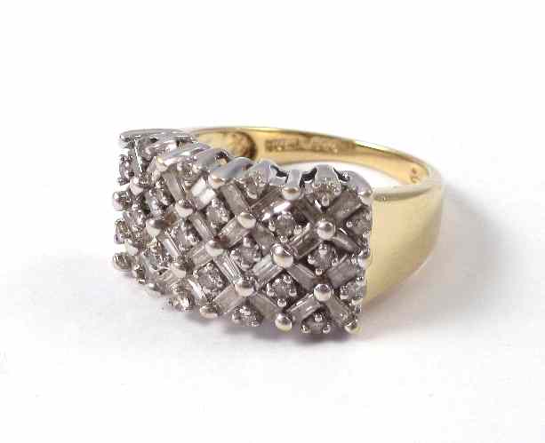 Appraisal: DIAMOND AND FOURTEEN KARAT GOLD CLUSTER RING the rectangular cluster