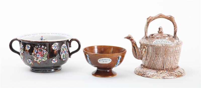 Appraisal: THREE ENGLISH POTTERY ARTICLES Comprising a Measham Bargeware two-handled chamber