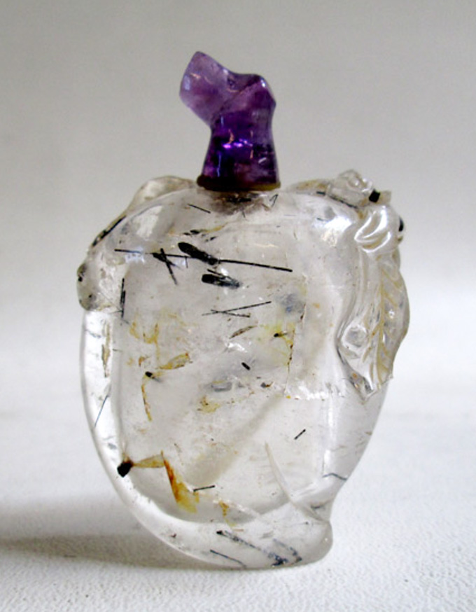 Appraisal: CHINESE ROCK CRYSTAL SCULPTED SNUFF BOTTLE having interior black rod-like