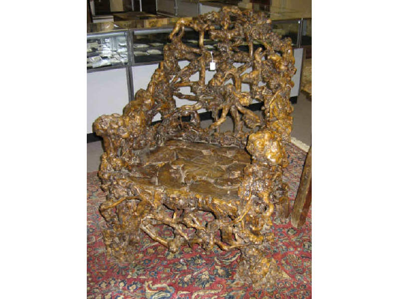 Appraisal: CHINESE ELM ROOT ARMCHAIR Large typical chair form made of