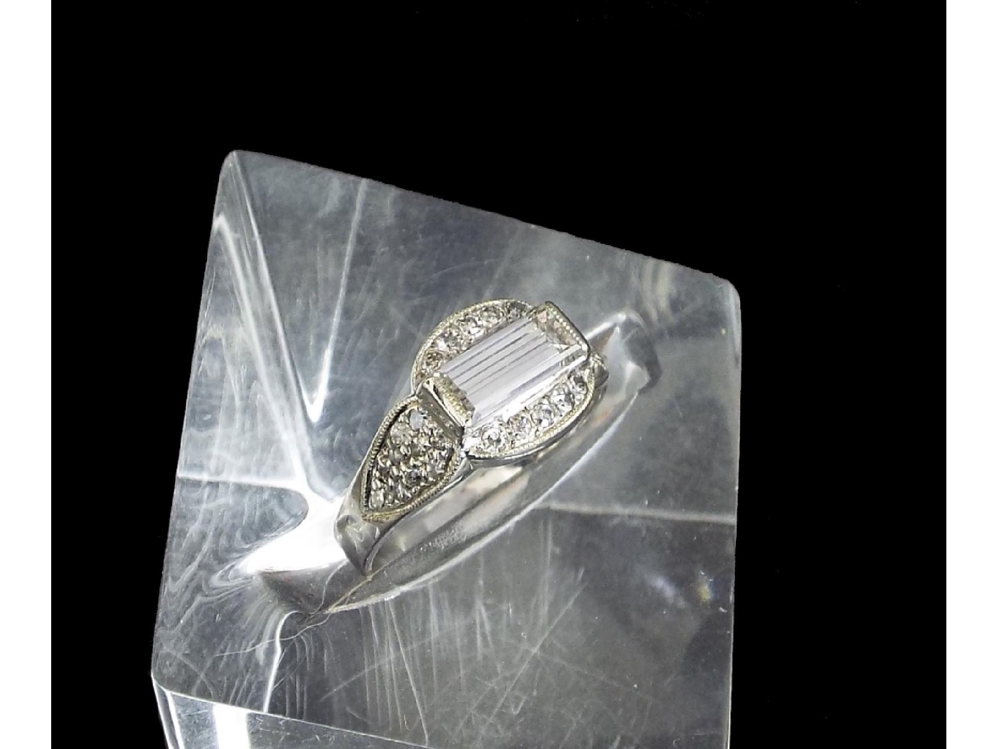 Appraisal: k white gold diamond set dress ring with a baguette-cut