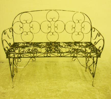 Appraisal: A WROUGHT IRON GARDEN BENCH th century with all over