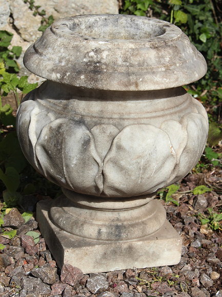 Appraisal: A SMALL TURNED AND CARVED MARBLE URN with leaf decoration