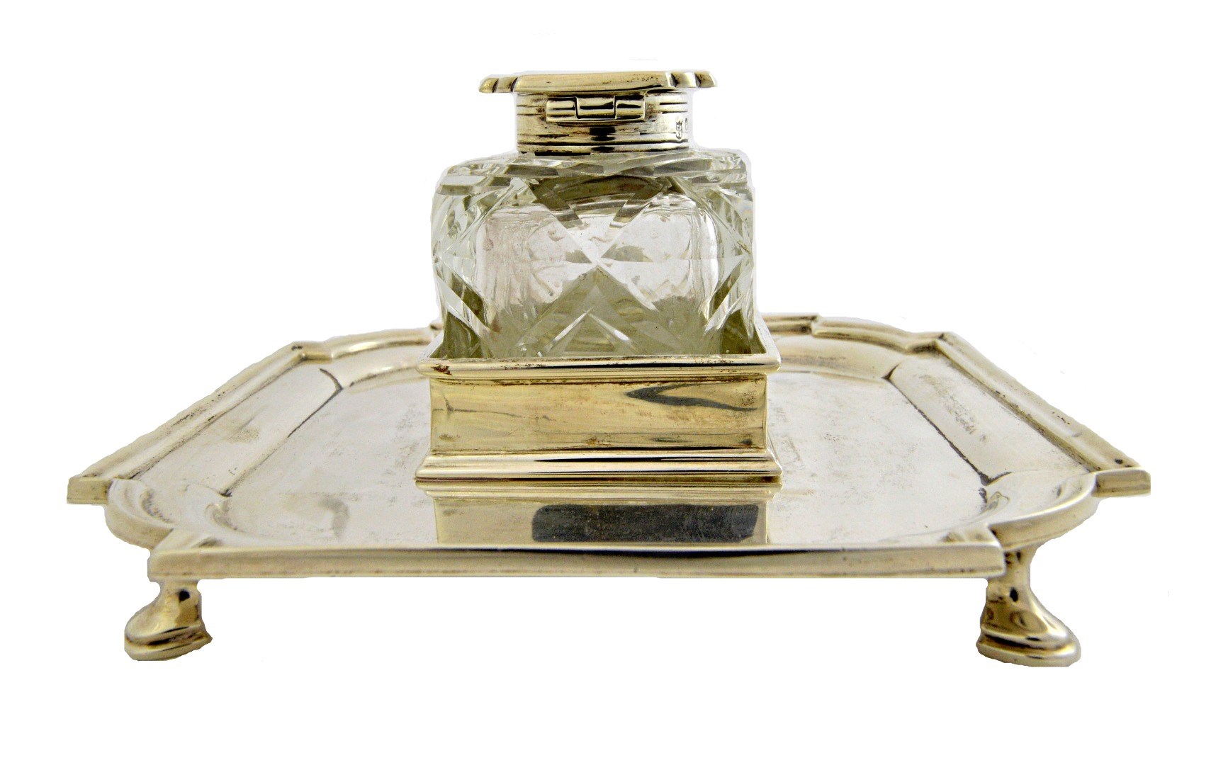 Appraisal: A silver mounted faceted glass hinge lidded ink bottle with