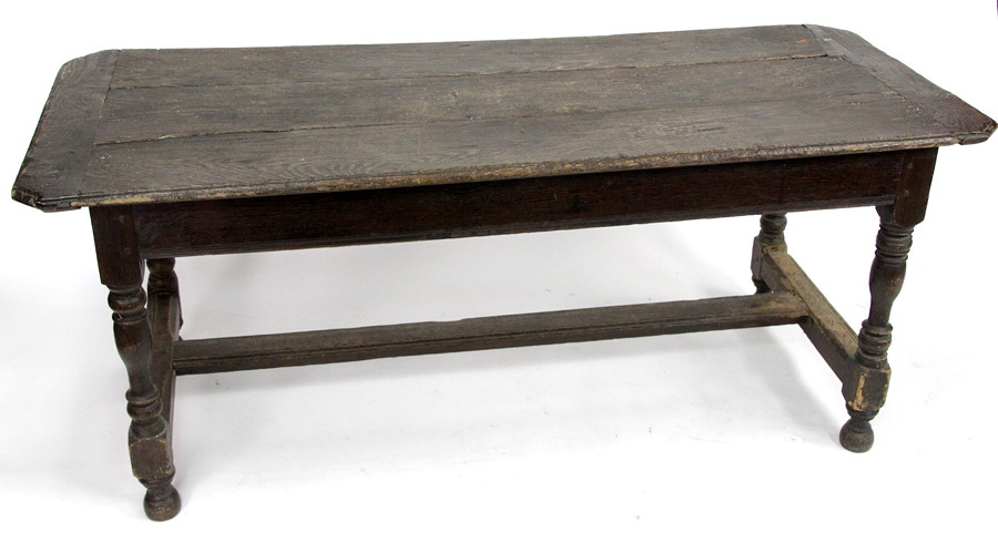 Appraisal: An oak and elm refectory table the three-plank top on