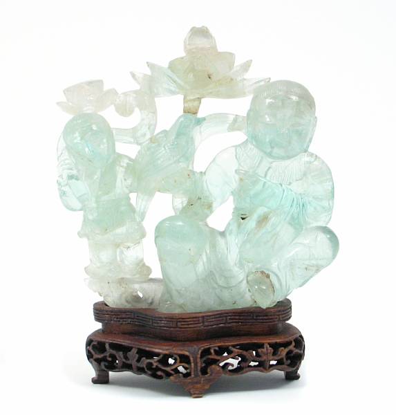 Appraisal: A Chinese small flourite figural carving together with a Japanese