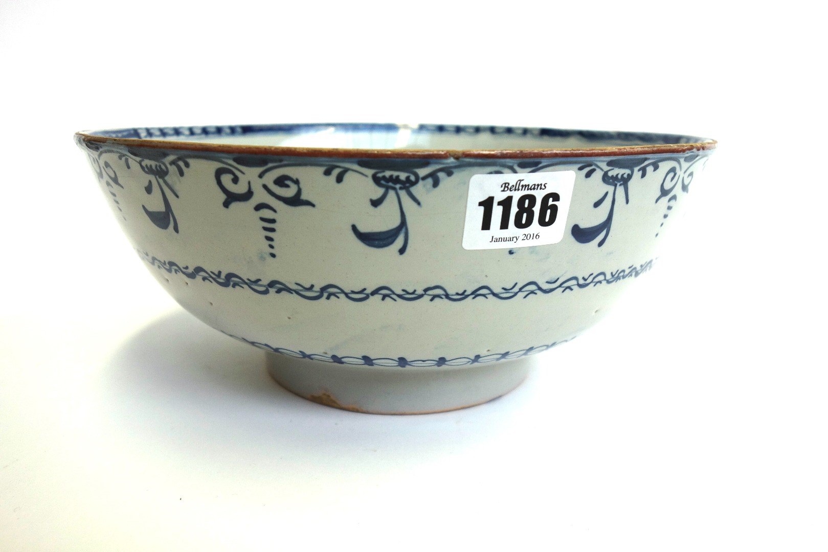 Appraisal: An English blue and white delftware bowl circa decorated with