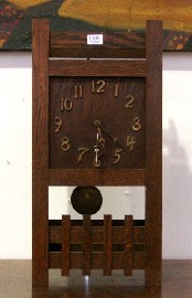 Appraisal: An American Arts amd Crafts oak mantle clock cm wide