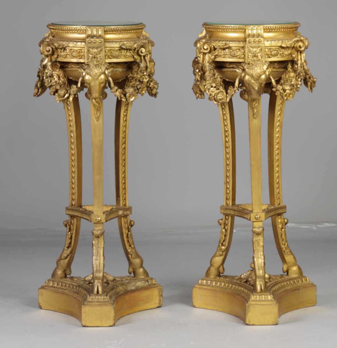 Appraisal: Continental Carved Giltwood Plant Stands With rams heads garland Condition