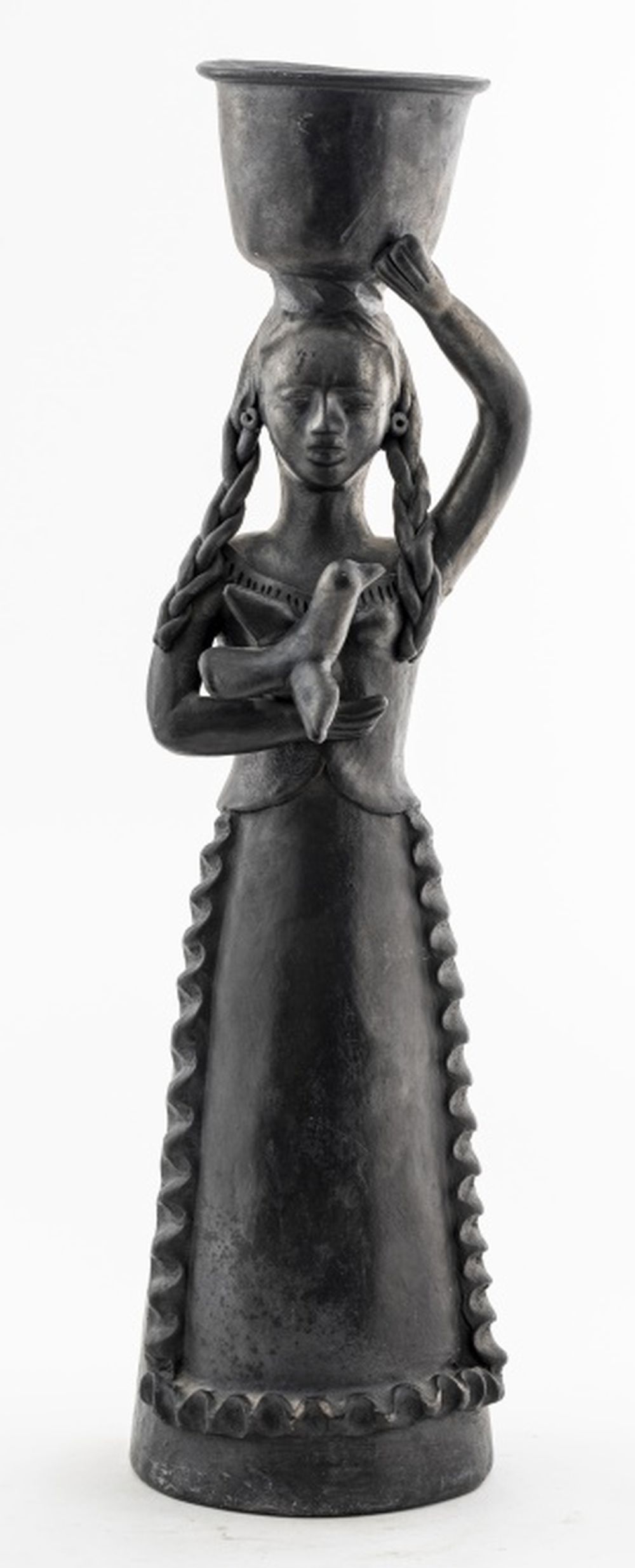 Appraisal: BLACK CLAY SCULPTURE OF WOMAN CARRYING BUCKET Folk Art manner