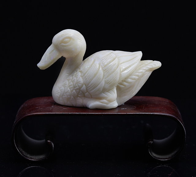 Appraisal: A Chinese opaline carving of a sitting duck th Centuryon