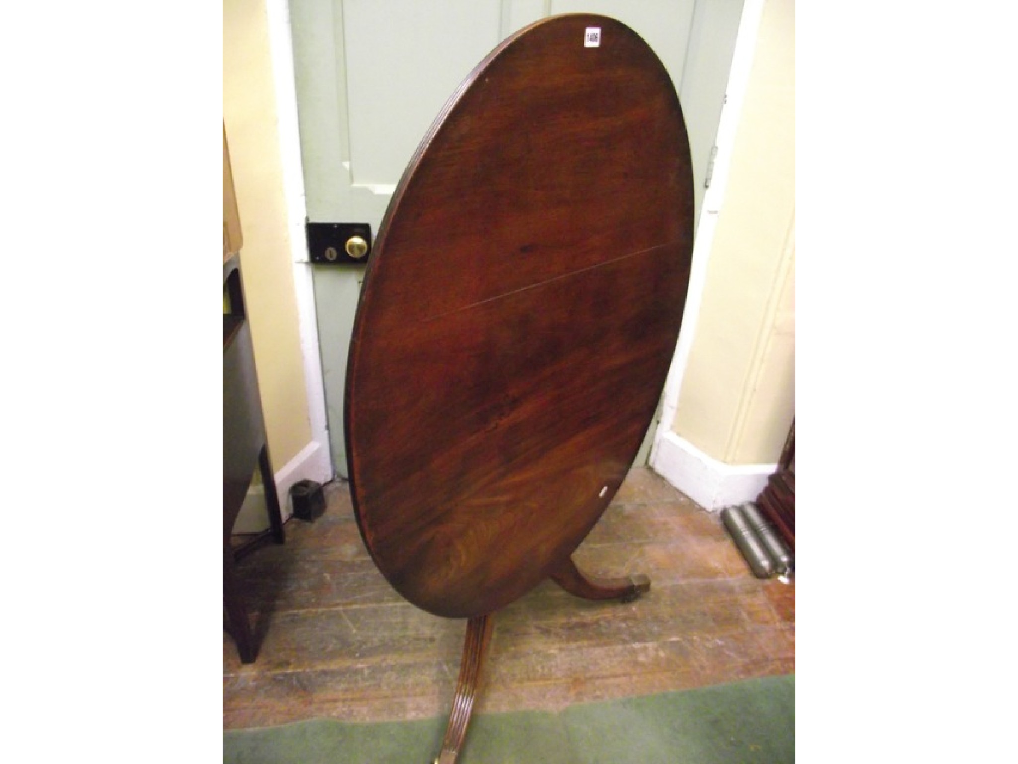 Appraisal: An early th century mahogany breakfast table the top of