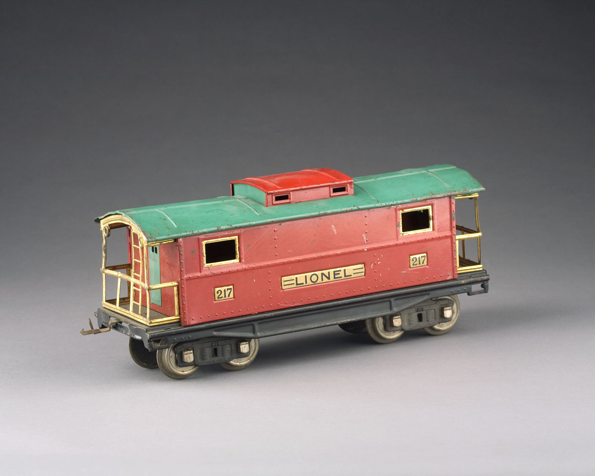 Appraisal: LIONEL CABOOSE IN RED PAINT WITH A GREEN ROOF