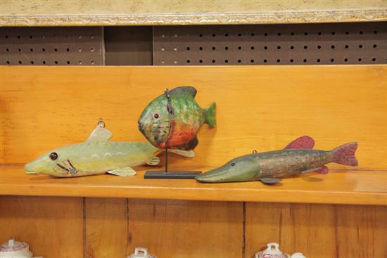 Appraisal: THREE FISH DECOYS Carved wood with polychrome paint and lead