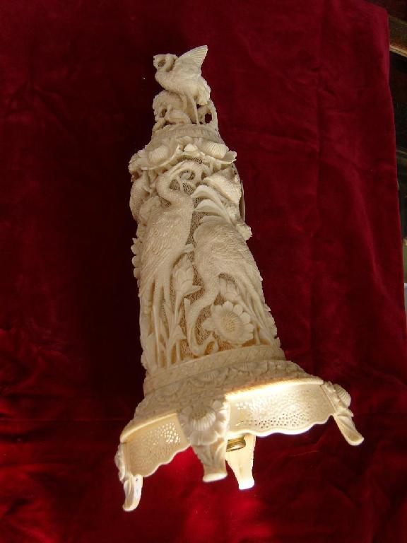 Appraisal: A Chinese ivory lamp with carved and pierced detail detailing