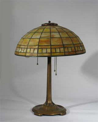 Appraisal: A Tiffany Studios bronze table lamp with matched geometric glass