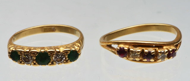 Appraisal: A FIVE STONE EMERALD AND DIAMOND RING three claw set