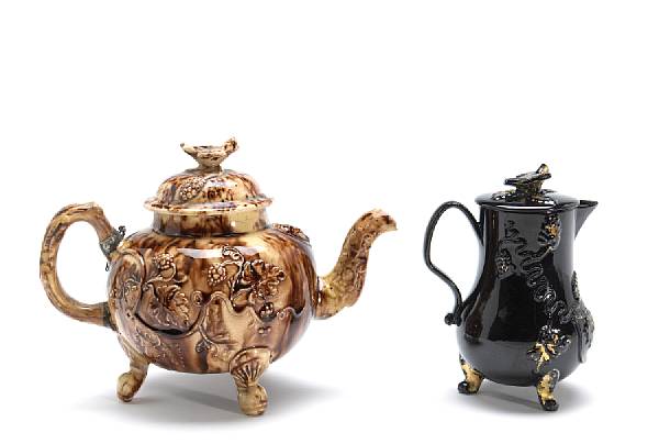 Appraisal: A Staffordshire tortoiseshell glazed teapot and Jackfield type covered pitcher