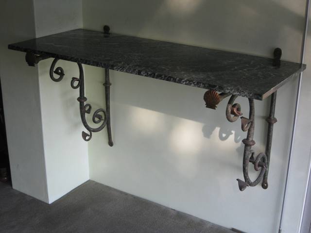 Appraisal: A th century Italian green painted wrought iron and marble