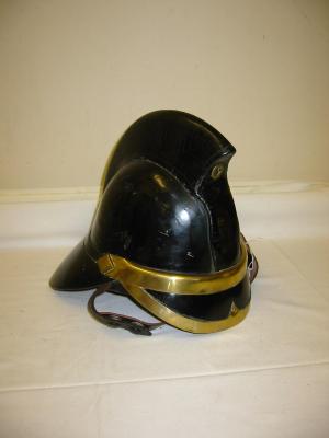 Appraisal: A LEATHER FIREMAN'S HELMET in black with brass mounted peak