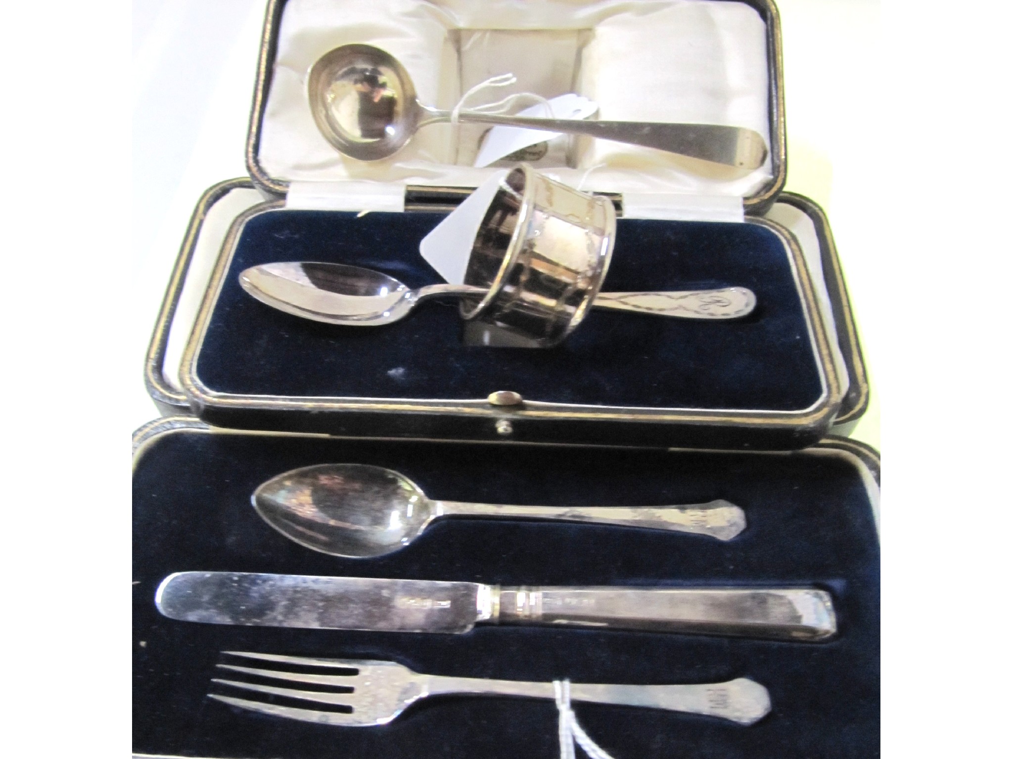 Appraisal: A lot comprising two cased silver christening sets Sheffield and