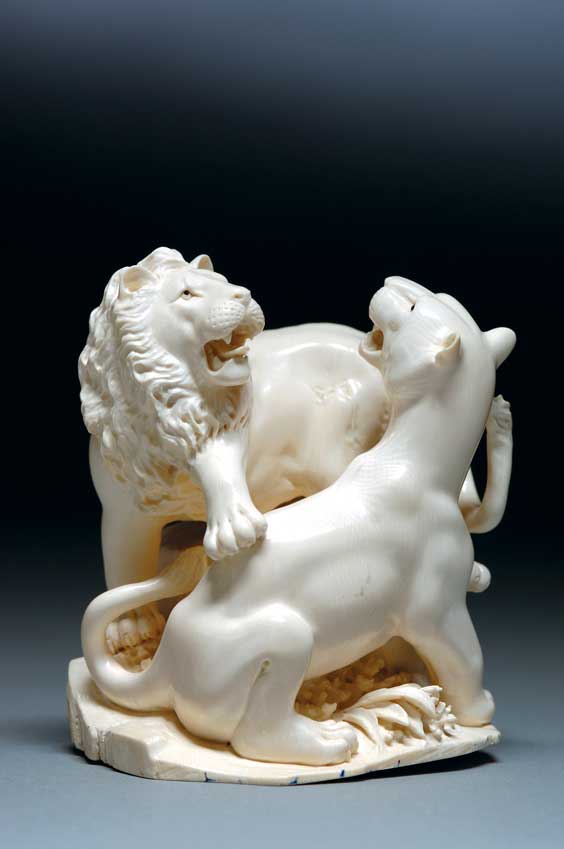 Appraisal: CARVED MAMMOTH IVORY LIONS Highly polished finely rendered mammoth ivory