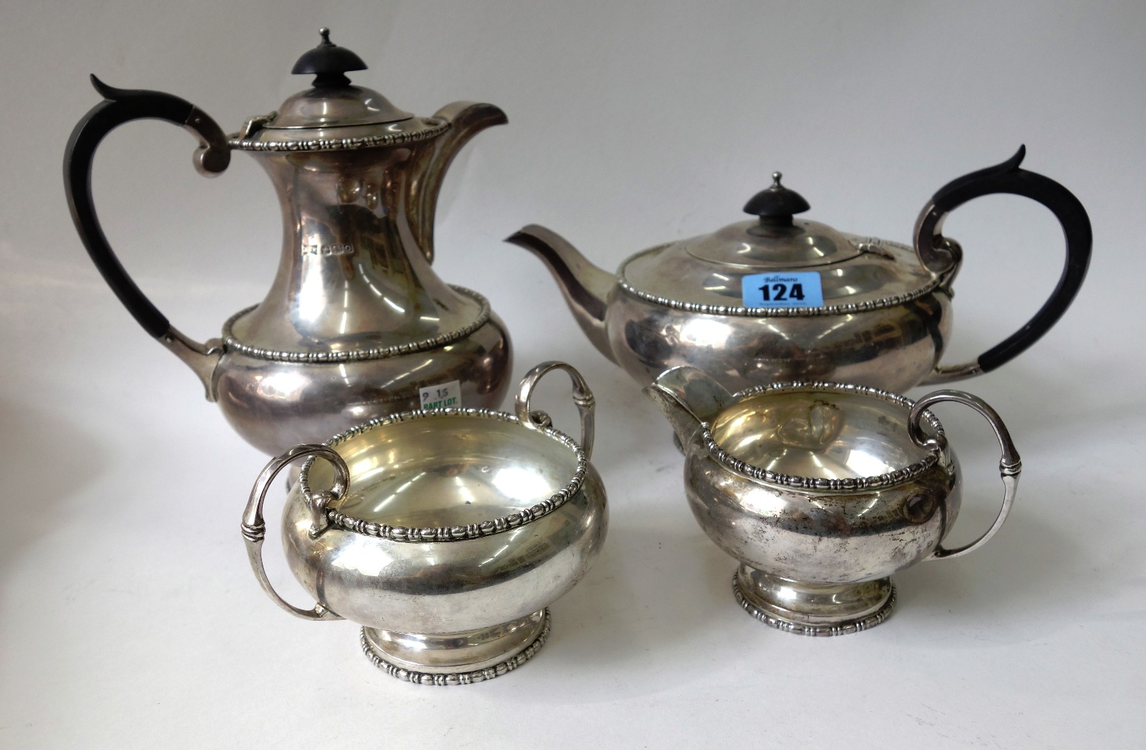 Appraisal: A silver four piece tea service Walker Hall Sheffield compressed