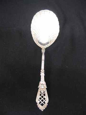 Appraisal: European Sterling Silver Berry Spoon elaborate openwork cherub handle with