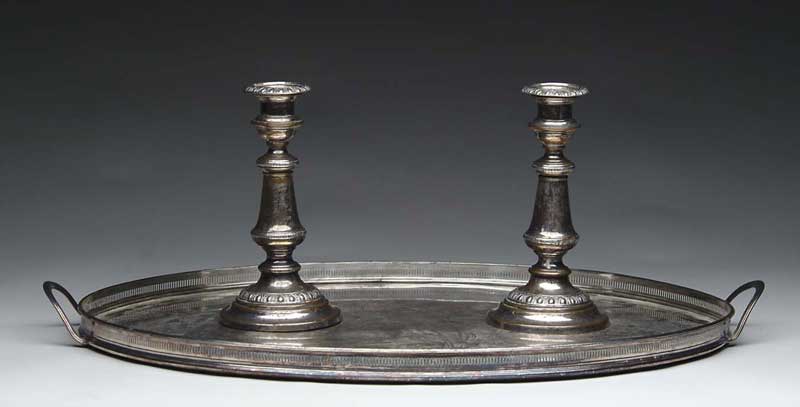 Appraisal: OVAL HANDLED TRAY AND PAIR OF SILVER PLATED CANDLESTICKS Unmarked