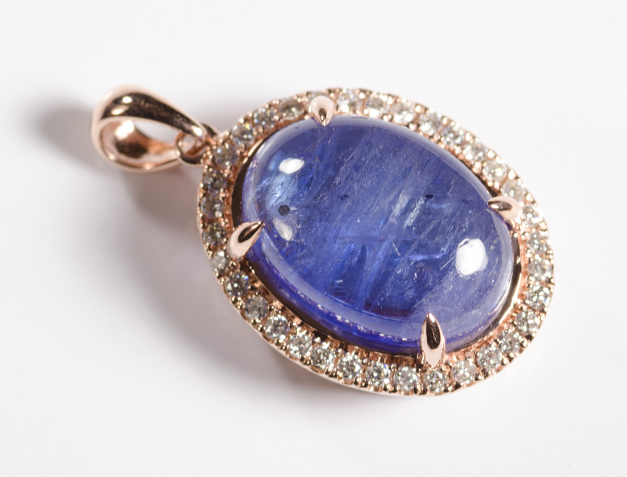 Appraisal: TANZANITE DIAMOND AND FOURTEEN KARAT ROSE GOLD PENDANT featuring an