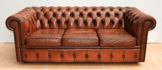 Appraisal: A three-seater Chesterfield sofa in tan leather