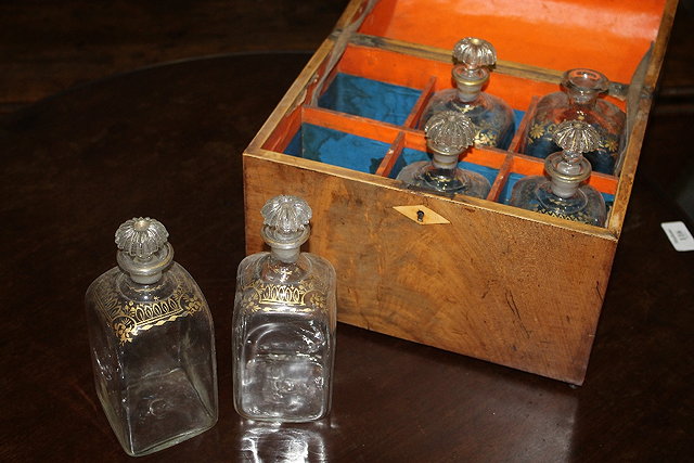 Appraisal: A REGENCY MAHOGANY DECANTER BOX with sloped front the interior