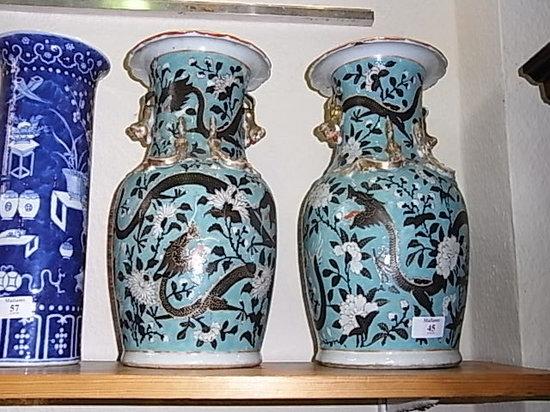 Appraisal: A PAIR OF CANTON TURQUOISE GROUND BALUSTER VASES with raised