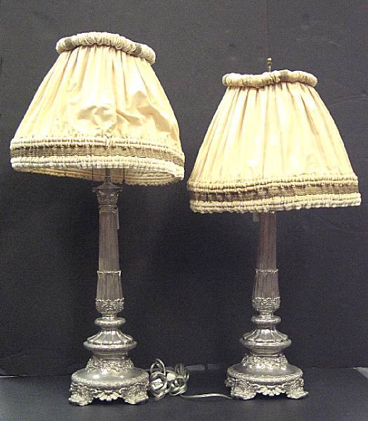 Appraisal: A pair of Regency style silver plated candlesticks second half