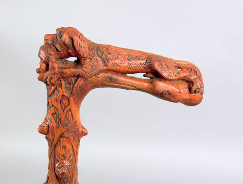 Appraisal: Carved cane ca with dog with a turtle in its