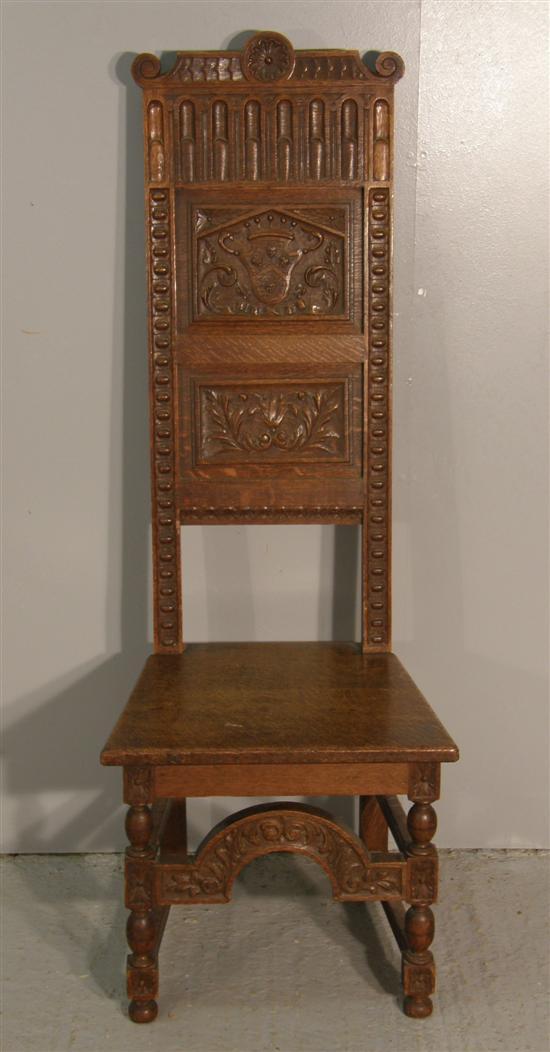 Appraisal: th century style oak high back hall chair the back